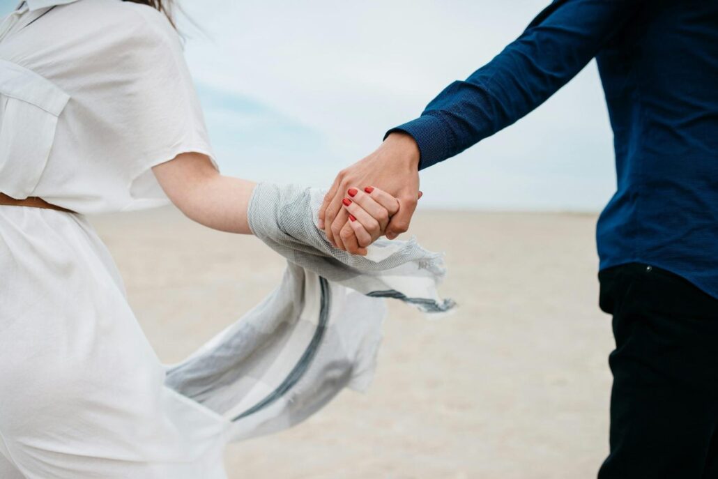 A couple holding hands at an addiction treatment center